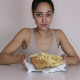 An attractive British girl eats some of her fish & chips meal, then takes a massive shit on top of it. Presented in 720P HD. 105MB, MP4 file. About 7 minutes.